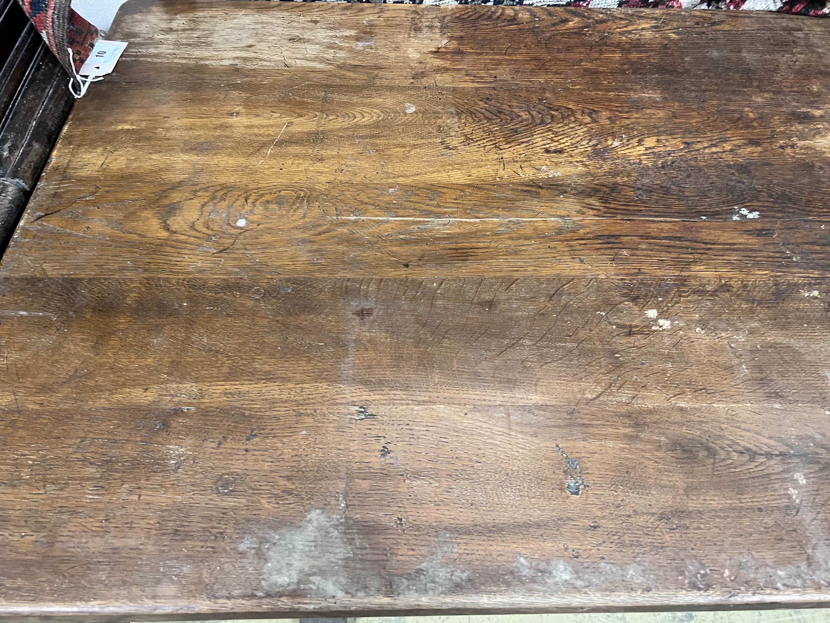 A 1920's rectangular oak dining table, length 145cm, depth 74cm, height 76cm